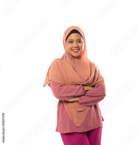 Asian hijab woman stand with crossed hands in isolated background with copyspace