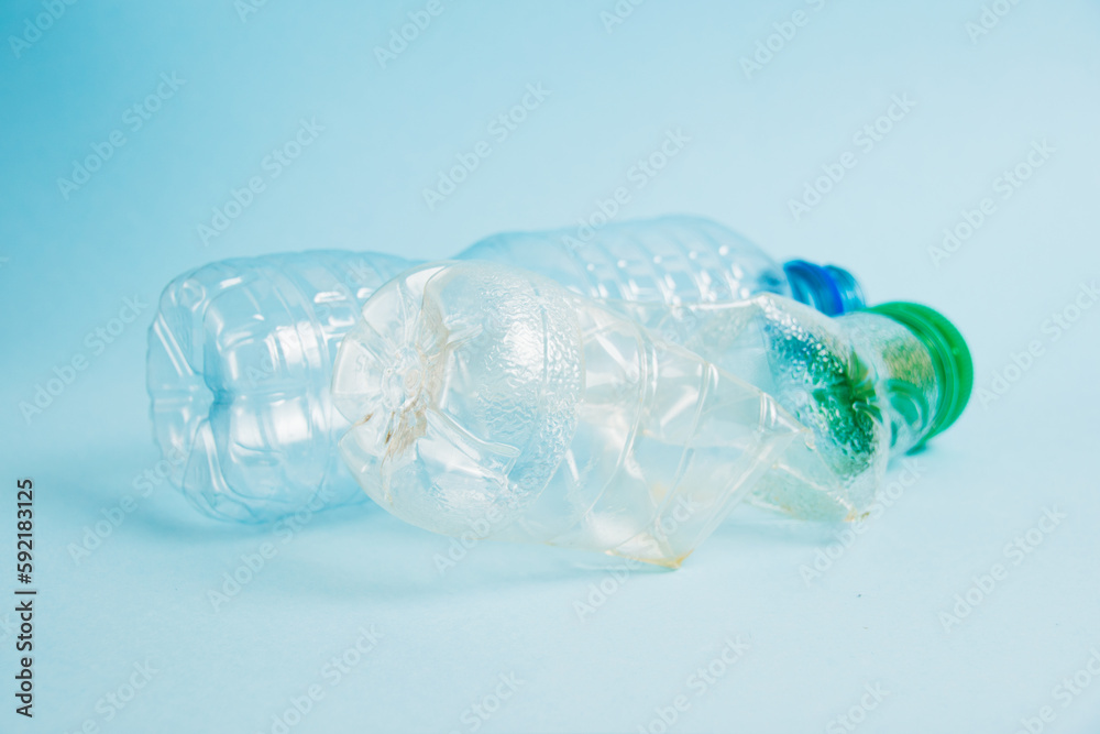 Plastic bottles from drinks on a paper background. Concept of earth day, zero waste and plastic recycling. Plastic bottles from drinks on a paper background. Concept of earth day, zero waste and plastic recycling.