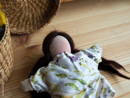 handmade waldorf natural doll sewn from fabric photo