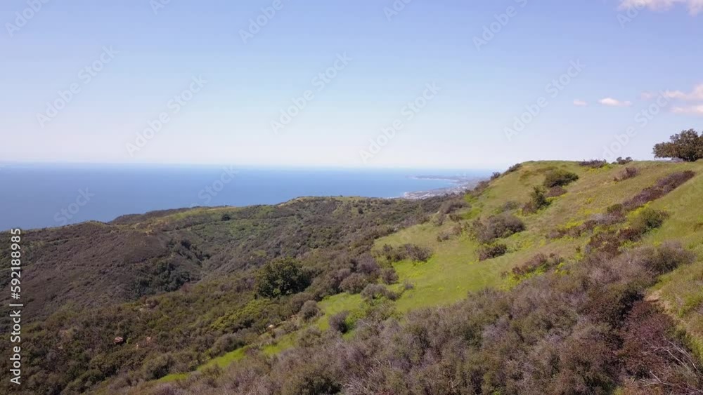 Panning 4K drone shot of Pacific Ocean and Santa Monica Mountains in Malibu, Los Angeles California Panning 4K drone shot of Pacific Ocean and Santa Monica Mountains in Malibu, Los Angeles California