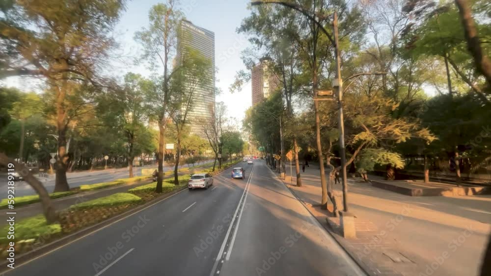 slow motion shot of avenida reforma in mexico city as it passes through the bosque de chapultepec slow motion shot of avenida reforma in mexico city as it passes through the bosque de chapultepec