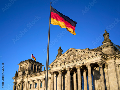German parliament with German flag  Reichstag building  in central Berlin
