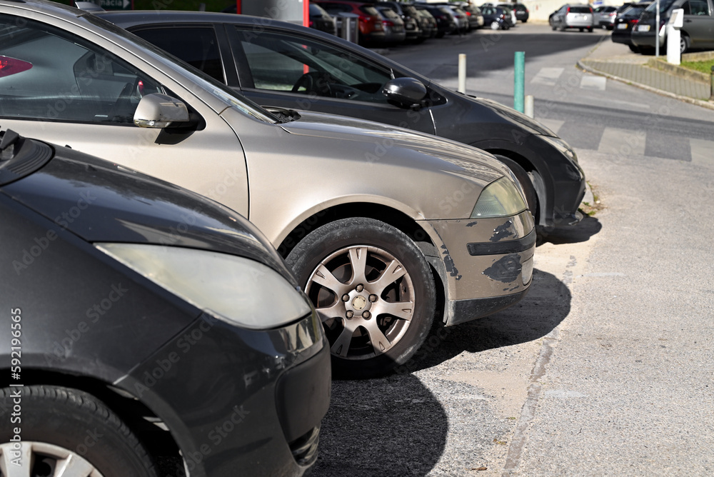 A scratched car is parked in the parking lot.The process of arranging car insurance.