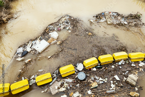 Fotografie Garbage collection from water river mouth with net
