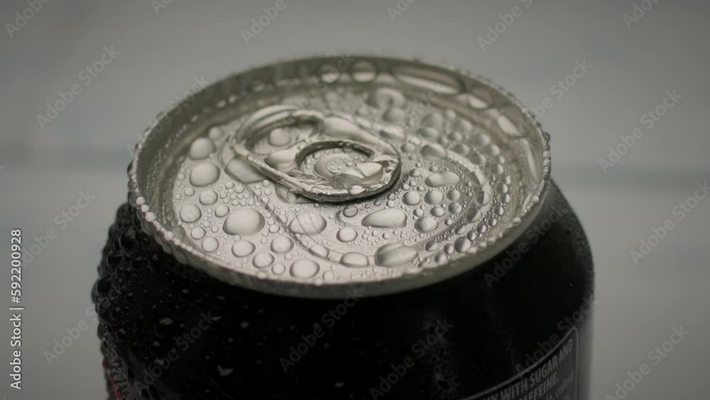 Black Cola Can Freezing. Cold wet can. Slow motion, close up. Black Cola Can Freezing. Cold wet can. Slow motion, close up.