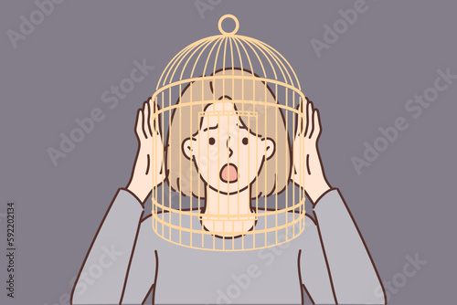 Girl with cage on head screams having fallen into mental trap negatively affects psychological state