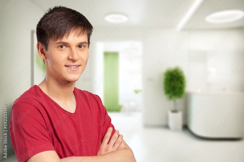Young happy man posing and looking at camera Young happy man posing and looking at camera