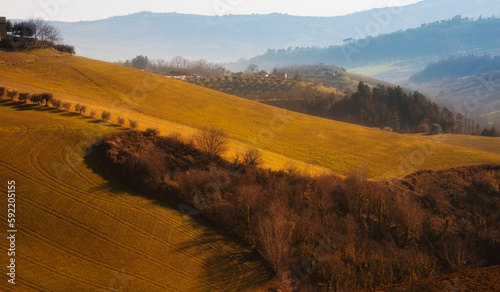 Countryside landscape in autumn, agricultural fields among hills