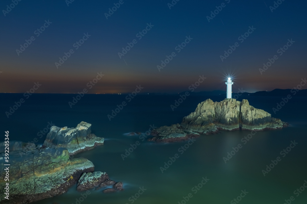 Reefs, lighthouses, and night views at sea on Dongji Island, Zhoushan City, Zhejiang Province, China On April 9, 2023