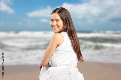Portrait of smiling young woman at the beach