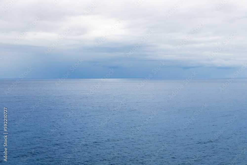 Calm ocean horizon. Calm sea background. Light blue color. Space for design and text Calm ocean horizon. Calm sea background. Light blue color. Space for design and text