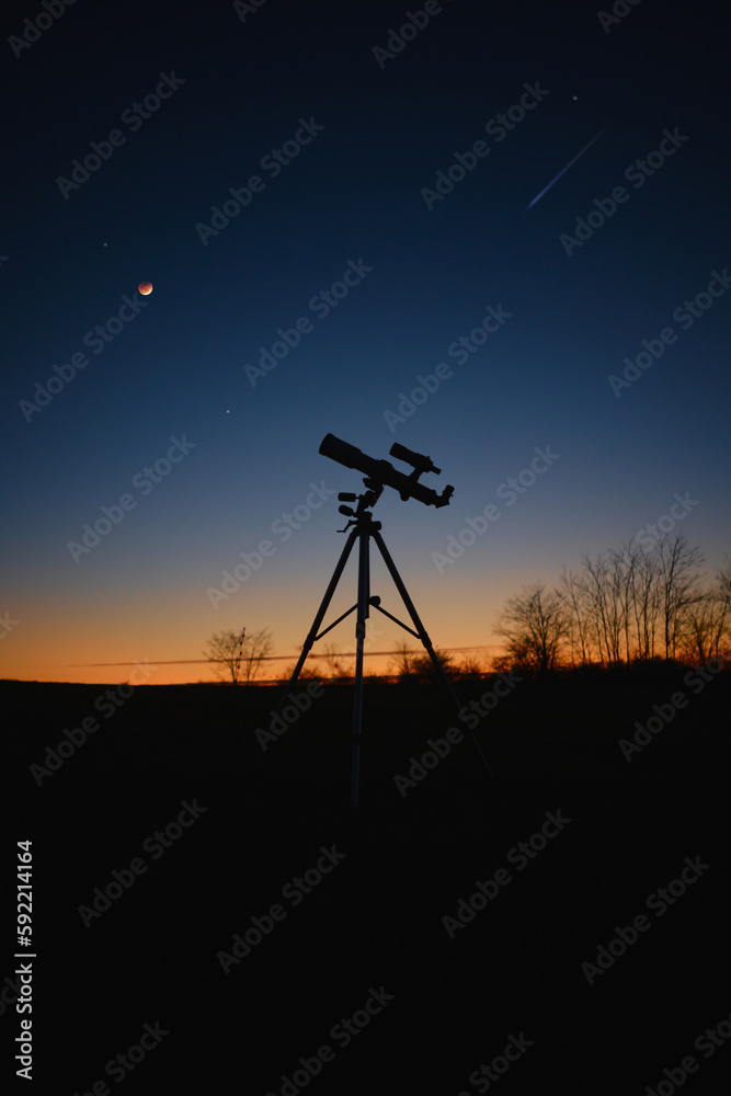 Astronomy telescope for observing stars, planets, Moon and other space objects with slightly out of focus stars on the sky.