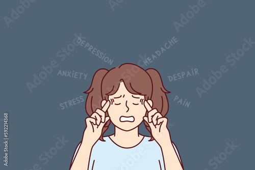 Little upset teen girl suffers from depression and headaches puts fingers to temples. Unhappy teenager schoolgirl needs help of psychologist to treat depression caused by anxiety and despair