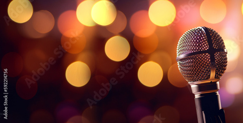 studio microphone in neon lights. sound recording equipment on bokeh background. Podcast,recording music concept microphone