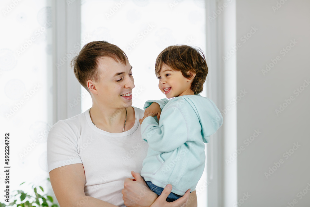 A portrait of a father with a child. Concept for the Father's Day holiday A portrait of a father with a child. Concept for the Father's Day holiday