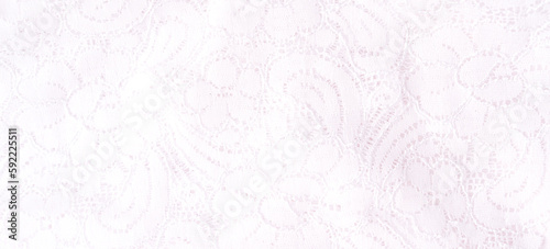 White tulle background with flower patterns.