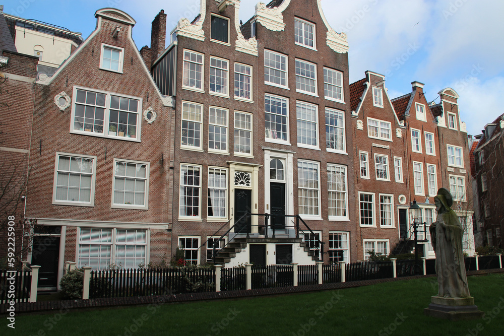 Fototapeta premium old brick houses at a beguinage (begijnhof) in amsterdam (the netherlands) 