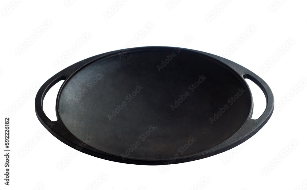 Black colored, empty clean cast iron roasting pan with handle on white surface Black colored, empty clean cast iron roasting pan with handle on white surface