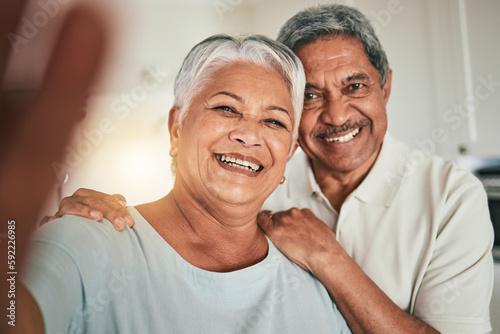 Happy, love and elderly couple smile for selfie, profile picture or photo in living room, cheerful and embrace. Portrait, retirement and excited old people hug enjoy retired lifestyle in their home