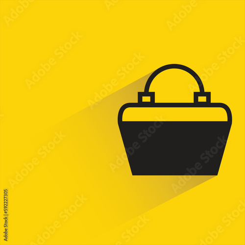 fashion bag with shadow on yellow background