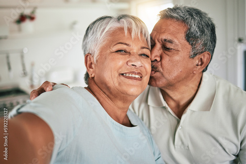 Selfie portrait, kiss and senior happy couple love, home romance and bonding on memory photo. Romantic marriage partner, face and elderly man, old woman or people smile on retirement time together
