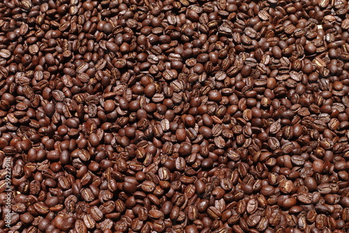 Top view of brown coffee beans  Roasted coffee beans background  Texture freshly roasted coffee beans.