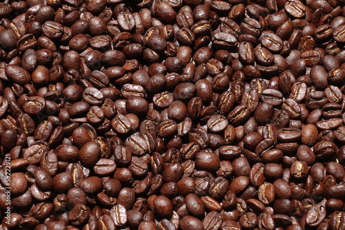 Top view of brown coffee beans  Roasted coffee beans background  Texture freshly roasted coffee beans.