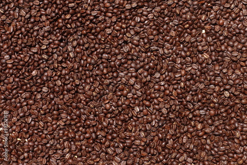 Top view of brown coffee beans  Roasted coffee beans background  Texture freshly roasted coffee beans.