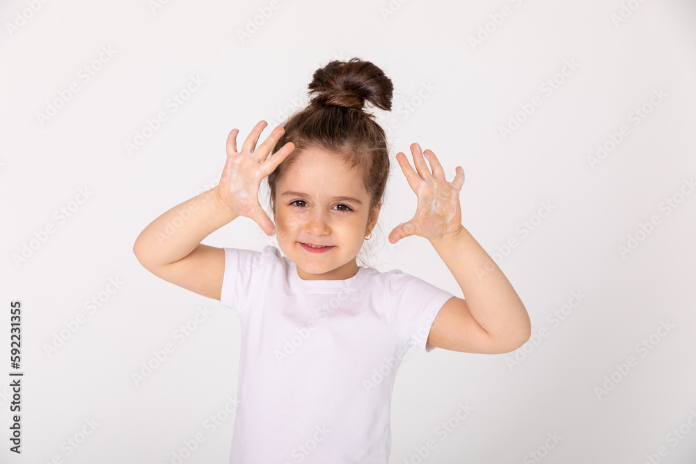 funny and joyful baby shows his soapy palms. Copy-space. Prevention of diseases with viruses and flu. The exposure time of the soap is at least 20 seconds. Studio photo, banner, isolated. funny and joyful baby shows his soapy palms. Copy-space. Prevention of diseases with viruses and flu. The exposure time of the soap is at least 20 seconds. Studio photo, banner, isolated.