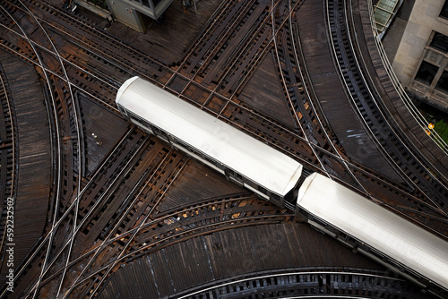 High angle view of passenger train on junction. Elevated railroad track in Chicago downtown. .