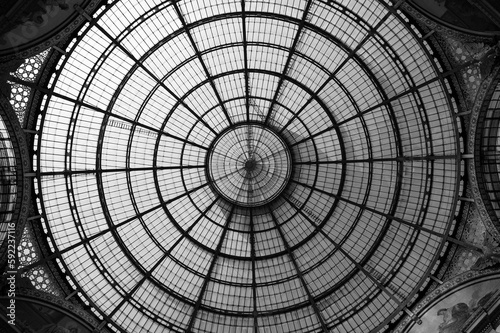Low angle grayscale shot of the Dome of Galleria Vittorio Emanuele II from inside
