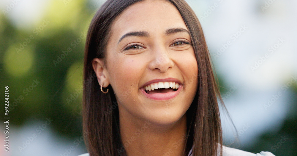 Portrait of a beautiful girl standing and commuting in the city. One happy and stylish young female smiling and relaxing downtown. Trendy young woman showing her teeth, laughing and traveling in town Portrait of a beautiful girl standing and commuting in the city. One happy and stylish young female smiling and relaxing downtown. Trendy young woman showing her teeth, laughing and traveling in town