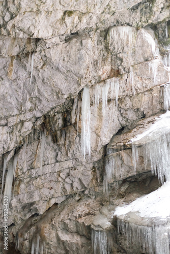 icicles in a cave with snow