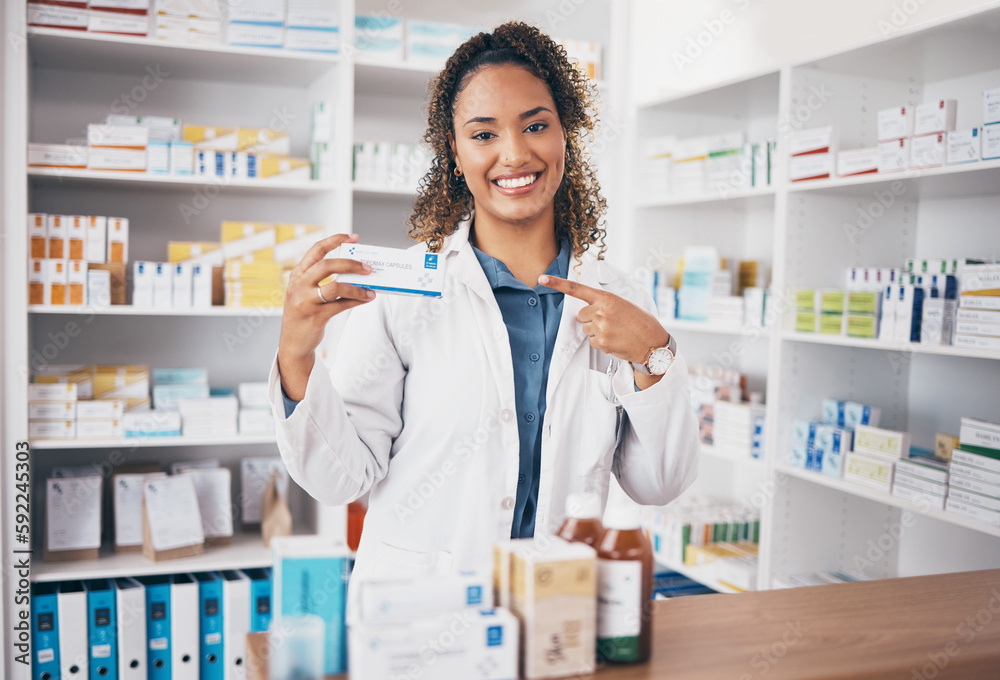 Pointing, pharmacist or portrait of happy woman with medicine in customer services or wellness clinic. Healthcare help desk, pharmacy or doctor smiling to promote medication or pills on drugstore