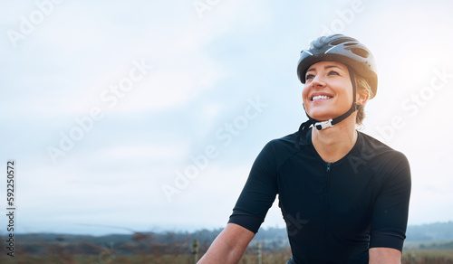 Smile, fitness and woman thinking while cycling in countryside, happy and relax in nature. Contemplate, sports and lady cyclist training in Mexico for travel, vacation or cardio, routine or workout