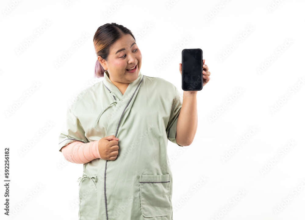 Female patient show and point mobile phone. Happy smiling asian women patient on white background. Fat and overweight obese woman. online doctor Female patient show and point mobile phone. Happy smiling asian women patient on white background. Fat and overweight obese woman. online doctor