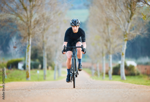 Cycling, fitness and travel with woman in park path for training, workout and health. Exercise, race and freedom with female cyclist riding on bike in nature for adventure, journey and transport