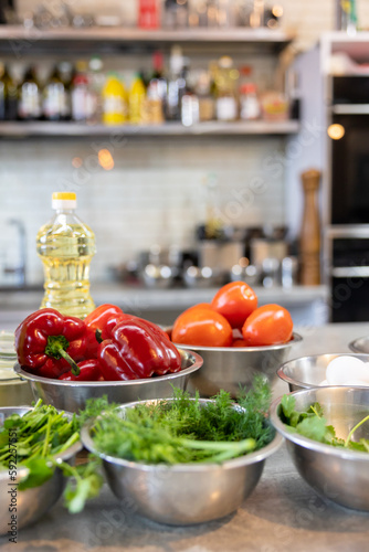 Fresh Vegetables lie in a metal bowls: tomatoes, asparagus, cucumbers, green. Fresh Vegetables lie in a metal bowls: tomatoes, asparagus, cucumbers, green.