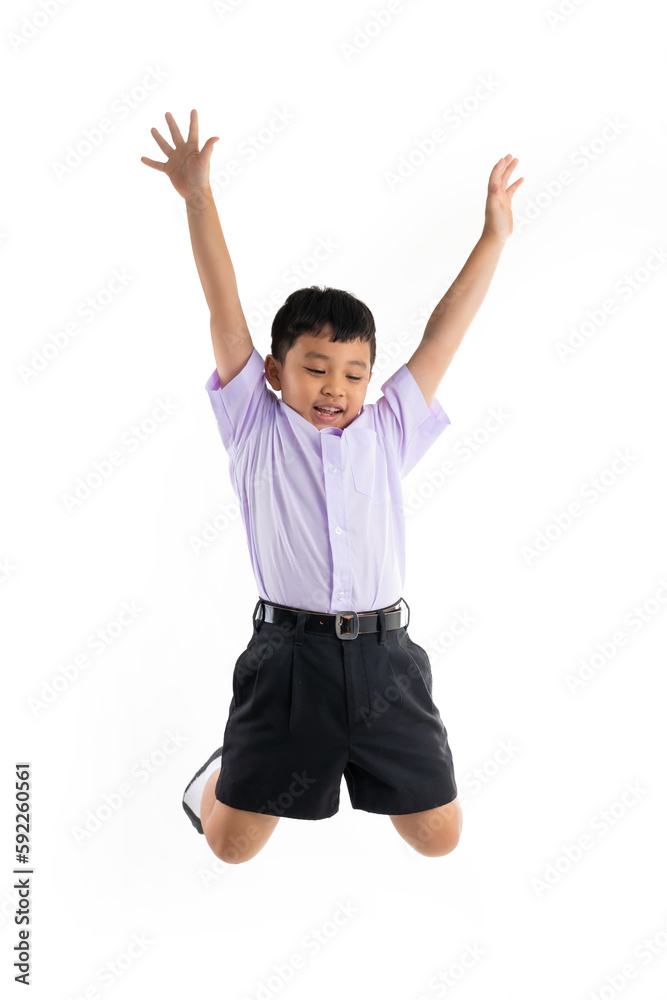 Happy boy jumping. Thai school uniform with backpack bag. Portrait Young Asian excite cute boy standing on white background banner. Back to school. Happy boy jumping. Thai school uniform with backpack bag. Portrait Young Asian excite cute boy standing on white background banner. Back to school.