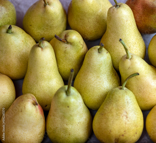 Heap of ripe pears fruit in market