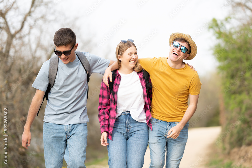 Teenagers enjoying together while walking in nature