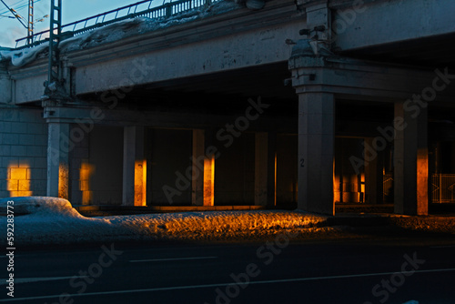 Sunset rays under road bridge industrial landscape