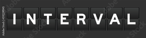 Black color analog flip board with word interval on gray background