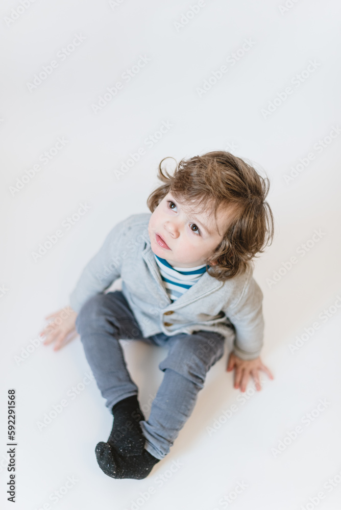 Close-up portrait of child lovely sweet curious cheerful cheery smart clever boy fantasize copy space isolated white color background Close-up portrait of child lovely sweet curious cheerful cheery smart clever boy fantasize copy space isolated white color background