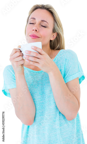 Peaceful blonde with hot beverage relaxing