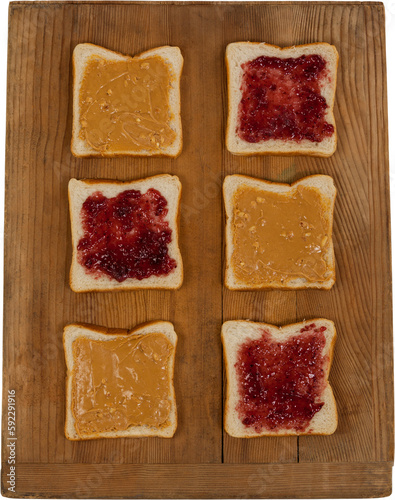 Bread with strawberry jam on wooden board
