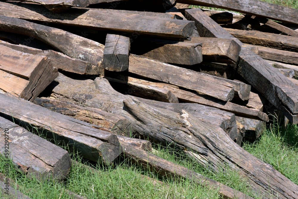 Unorganized pile of logs and wooden beams Unorganized pile of logs and wooden beams
