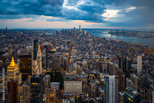 The illuminated lower Manhattan and dark blue rainy clouds. © Ondrej Bucek