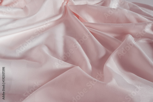 Abstract pink fabric background, satin stripe texture, wavy folds of elegant expensive fabric