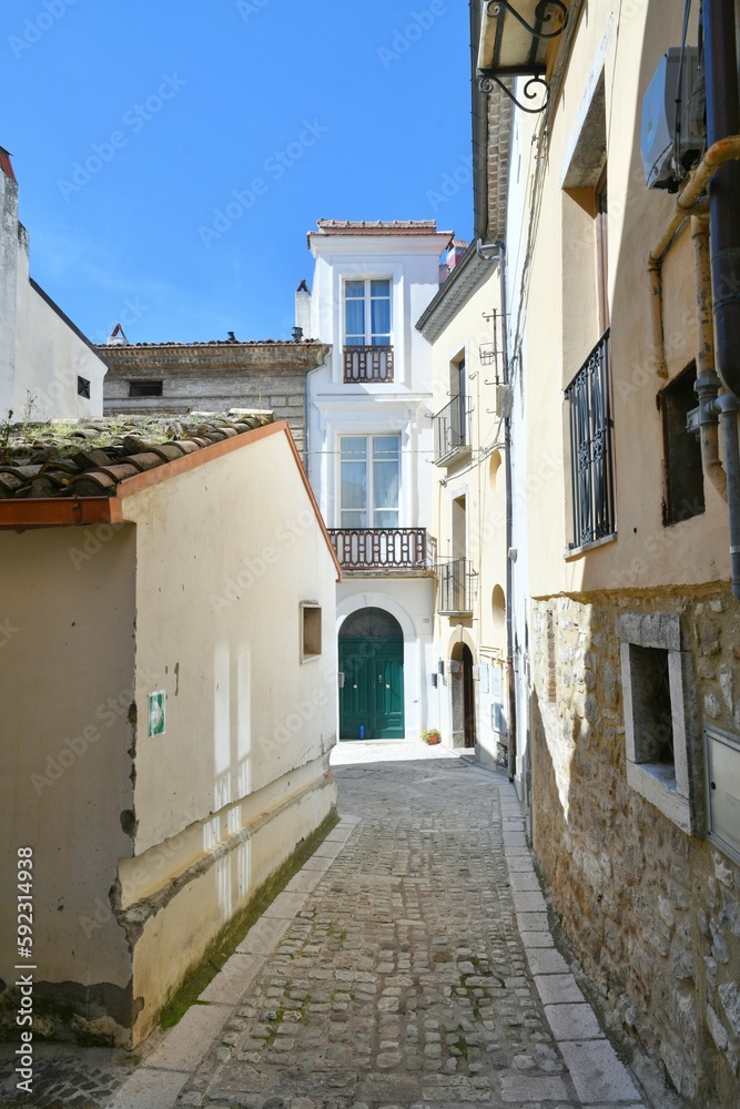 A narrow street among the old houses of Larino, a medieval town in the province of Campobasso in Italy.